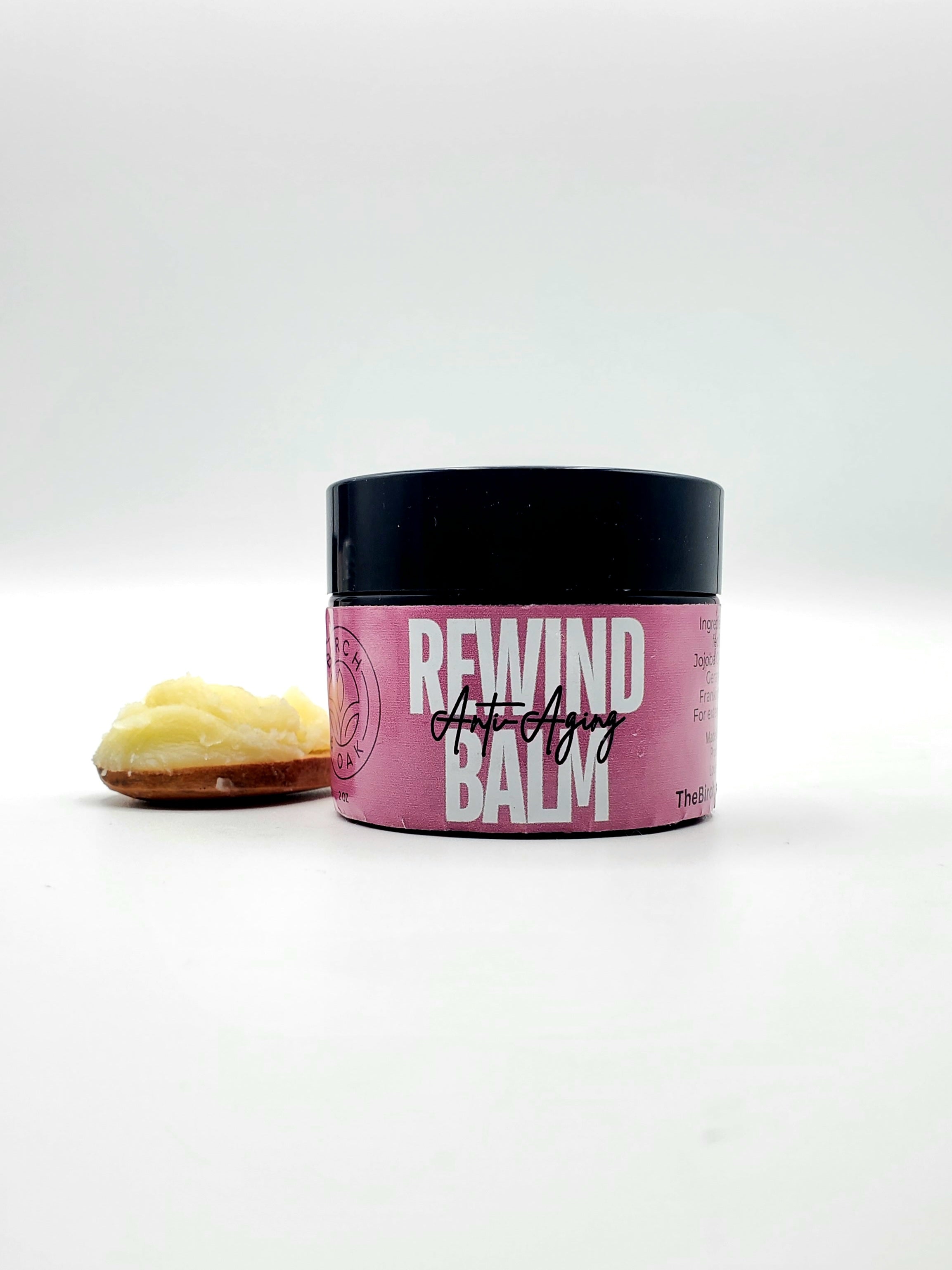 Jar of 'Rewind Anti Aging Balm' with a white background