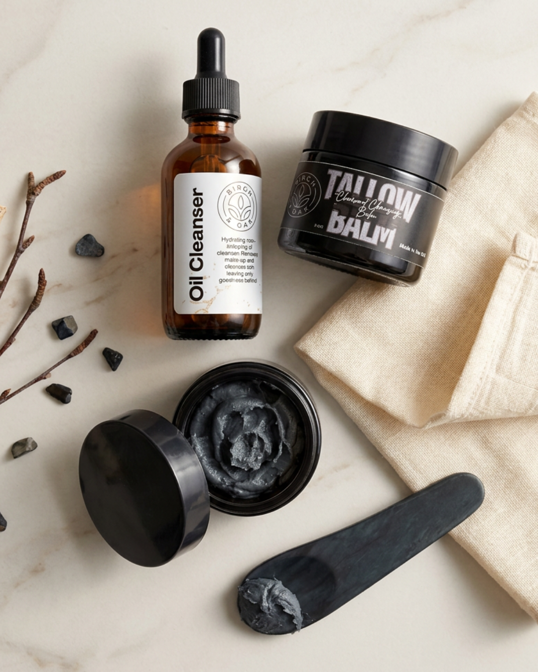 Skincare products including a bottle, jar, and black container on a light background